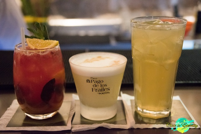 A fruity cocktail on the left, Pisco Sour in the center, Chilcano on the right 